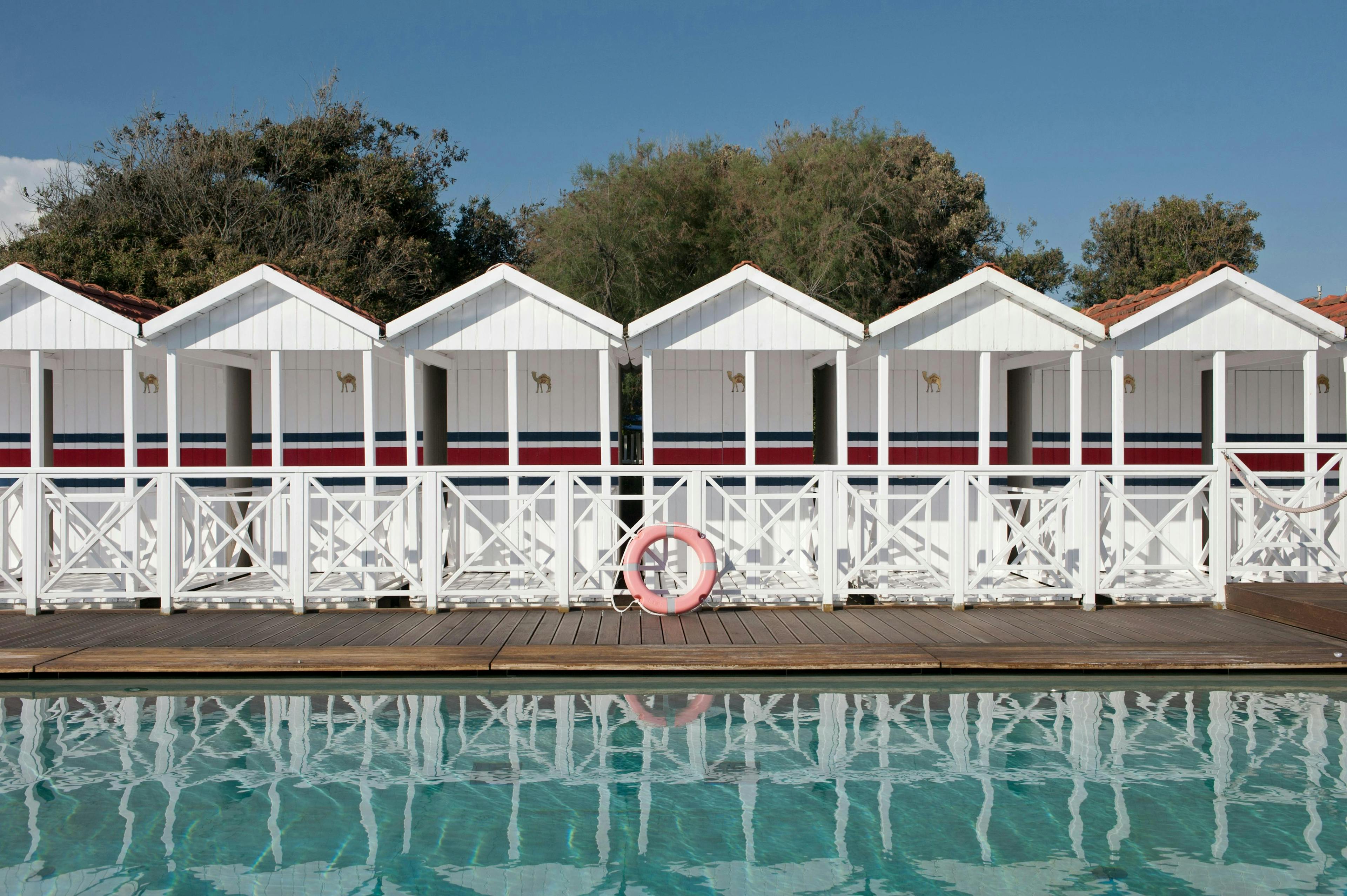 water waterfront hotel resort pier shelter housing porch pool nature